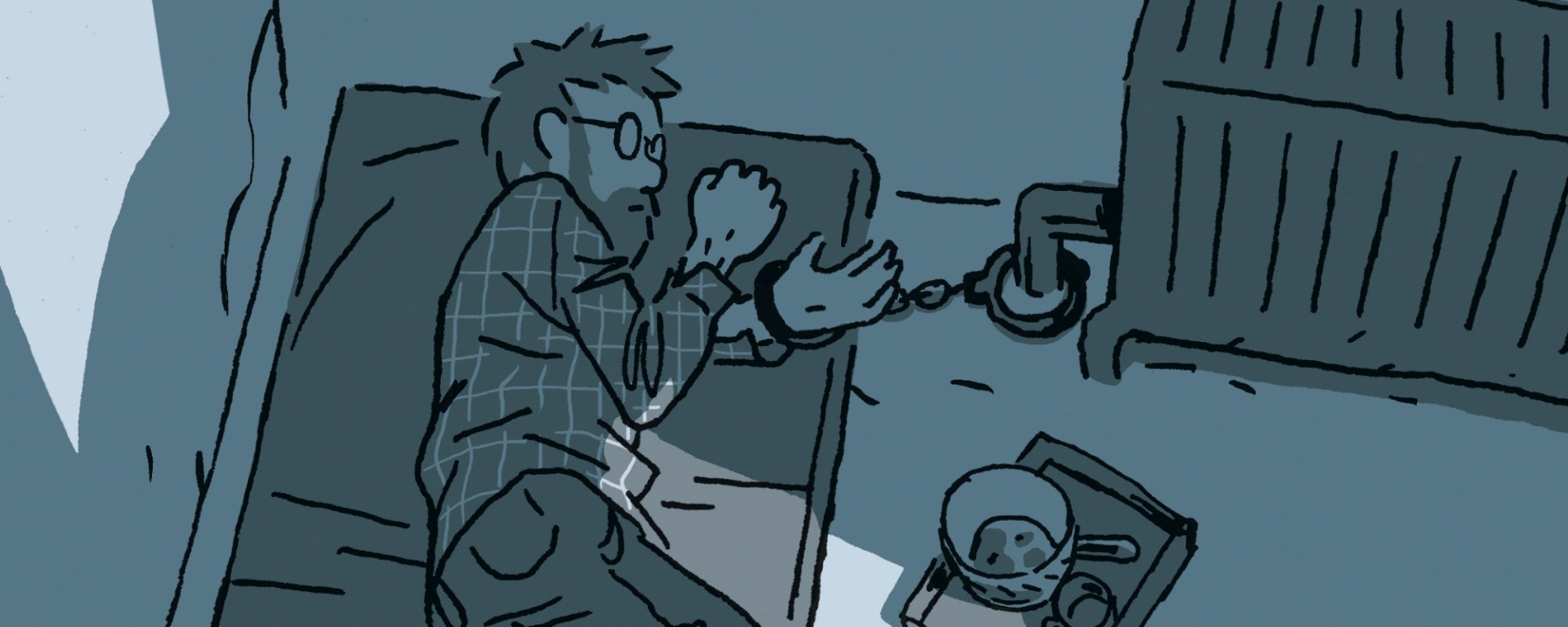 homme menotté à un radiateur